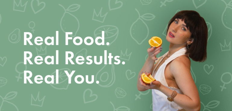 Certified personal nutritionist enjoying a fresh orange in a bright kitchen, promoting healthy eating and balanced nutrition